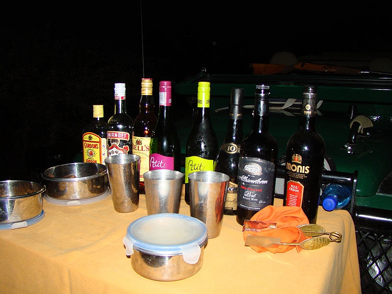 sundowners2.jpg - For some reason, our Land Rover always ran out of wine first.