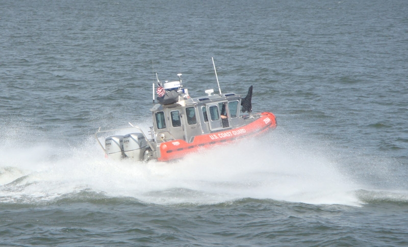 cg3.jpg - The Coast Guard then put on a special demonstration for Regent Guests.  They demonstrated a Sea Rescue.